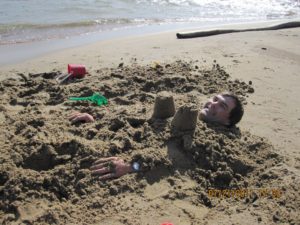 n20_swimming_geoff buried in sand_web